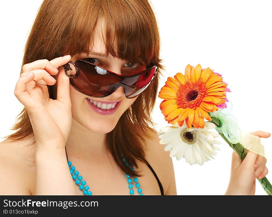 Happy young girl with flowers over white