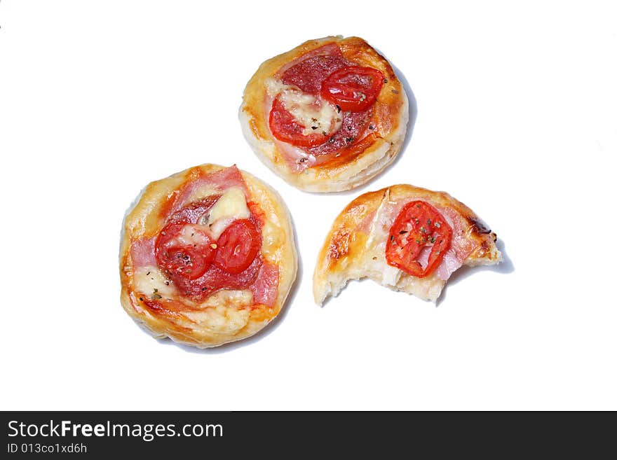 Salt pizza cake with tomato and salami bitten. Salt pizza cake with tomato and salami bitten