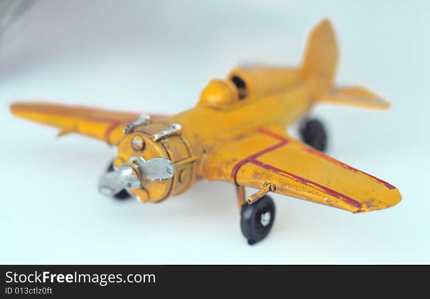 A small yellow plane, close up. A small yellow plane, close up