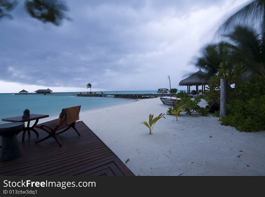 An open air bar in a tropical resort in the Maldives before storm