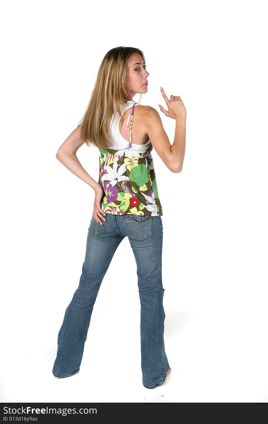 Pretty teen back to with her finger raised in shooting position