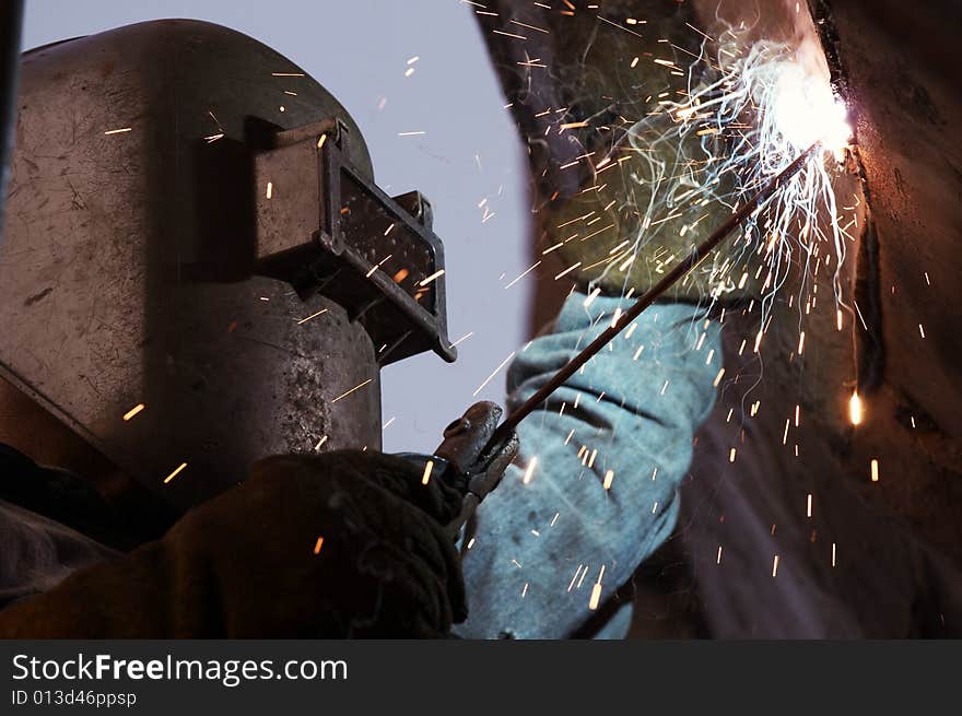 A arc welder busy at work. A arc welder busy at work