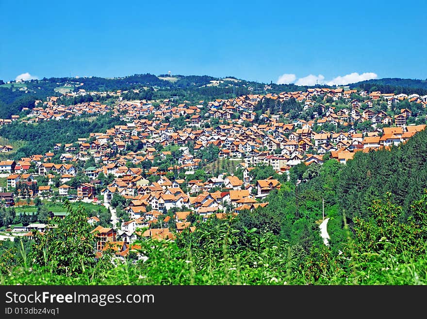 Rural landscape of serbian village,green hill and blue sky