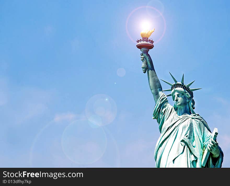 Statue of Liberty fragment over blue sky