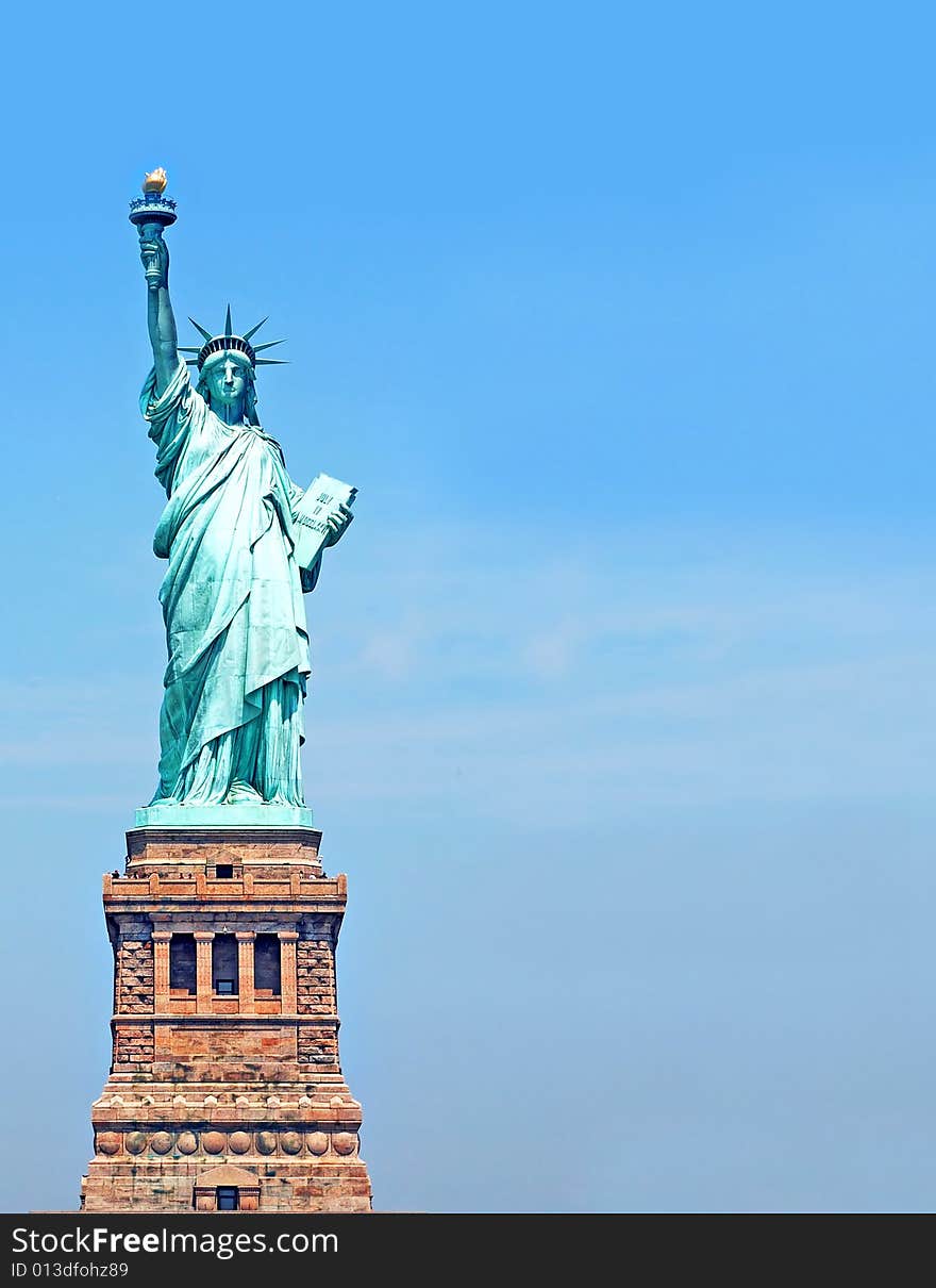 Statue of Liberty fragment over blue sky