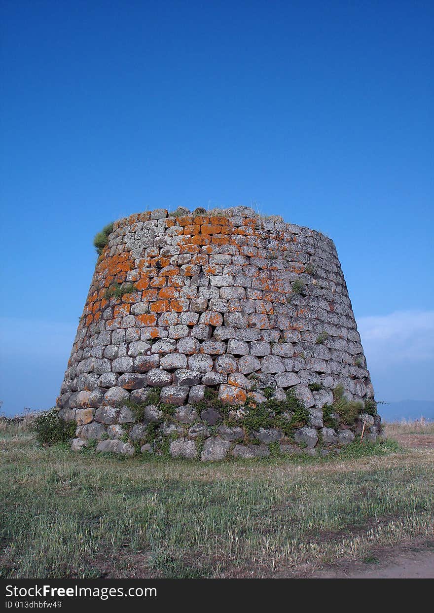 Nuraghe of Santa Sabina in Silanus - Sardinia (Italy). A nuraghe is a typical megalithic sardinian construction of the Bronze Age. Nuraghe of Santa Sabina in Silanus - Sardinia (Italy). A nuraghe is a typical megalithic sardinian construction of the Bronze Age.