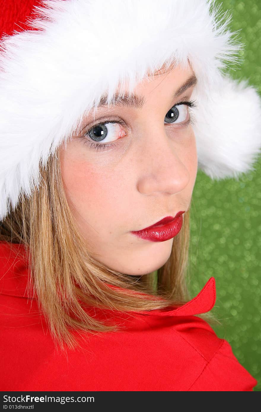 Teenager with red lips wearing a christmas hat. Teenager with red lips wearing a christmas hat