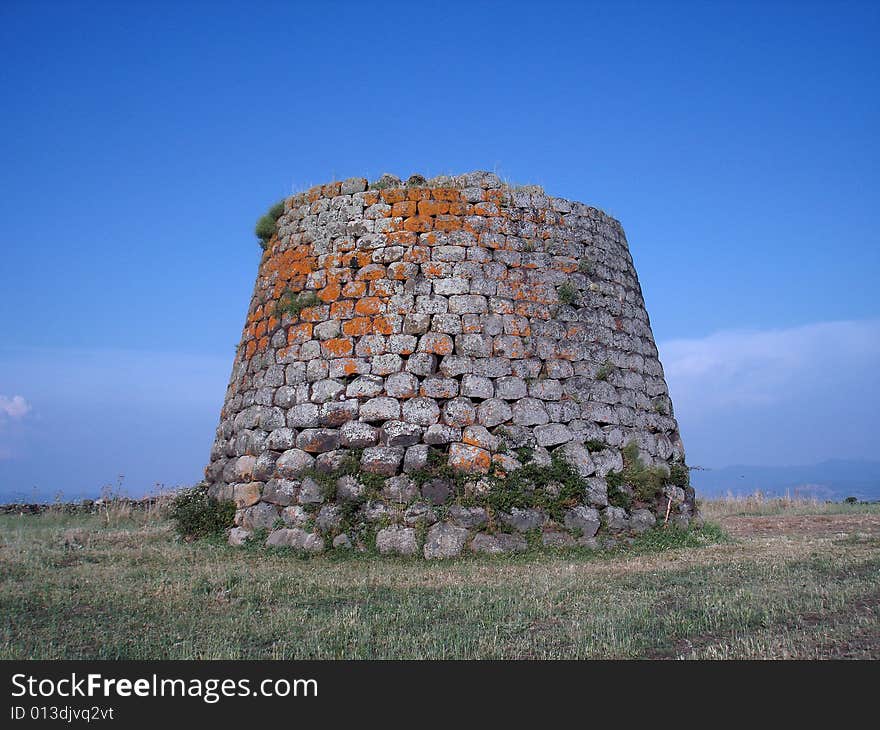 Nuraghe of Santa Sabina in Silanus - Sardinia (Italy). A nuraghe is a typical megalithic sardinian construction of the Bronze Age. Nuraghe of Santa Sabina in Silanus - Sardinia (Italy). A nuraghe is a typical megalithic sardinian construction of the Bronze Age.