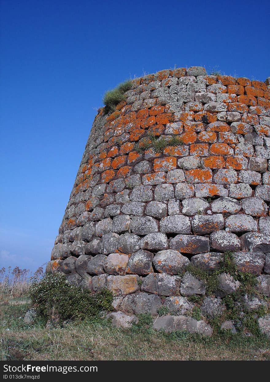 Nuraghe of Santa Sabina in Silanus - Sardinia (Italy). A nuraghe is a typical megalithic sardinian construction of the Bronze Age. Nuraghe of Santa Sabina in Silanus - Sardinia (Italy). A nuraghe is a typical megalithic sardinian construction of the Bronze Age.