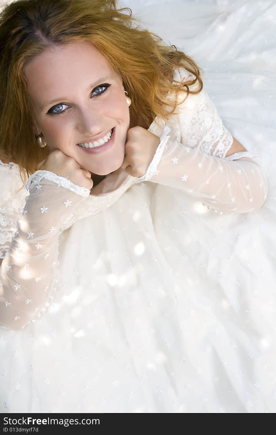 Smiling bride seated down