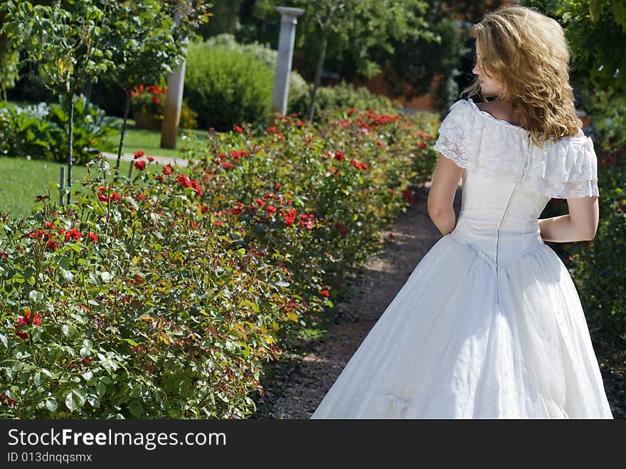 Bride walking along an alley