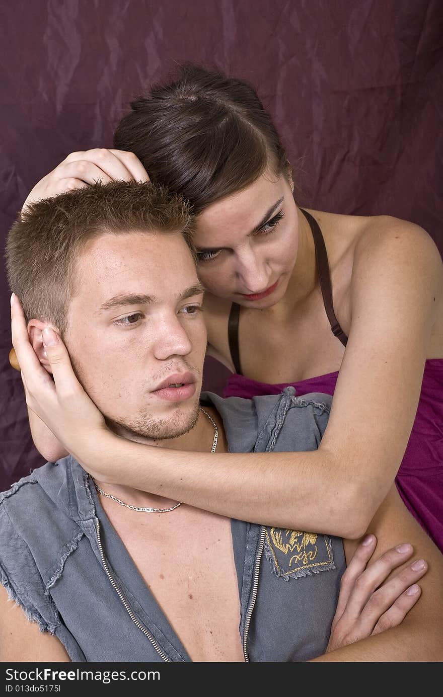 Young couple posing in studio. Young couple posing in studio