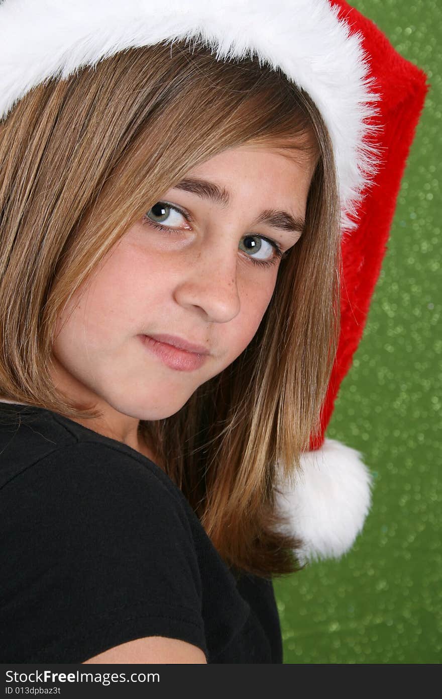 Teenager with red lips wearing a christmas hat. Teenager with red lips wearing a christmas hat