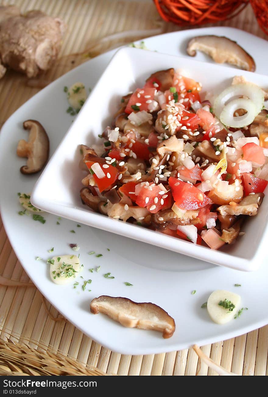 Fresh salad of mushrooms and tomatoes with oil and vinegar