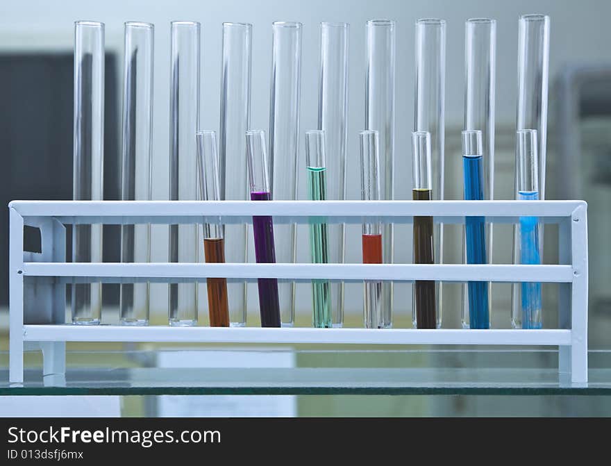 Test tubes in a rack,some of them containing colorful solutions. Test tubes in a rack,some of them containing colorful solutions.