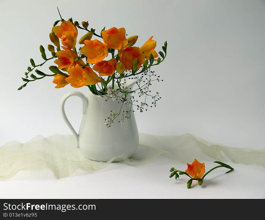 Yellow flowers in white jug. Yellow flowers in white jug