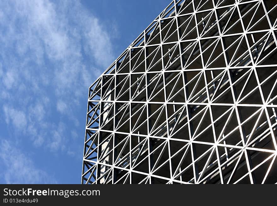 Abstract metallic building and blue sky horizontal