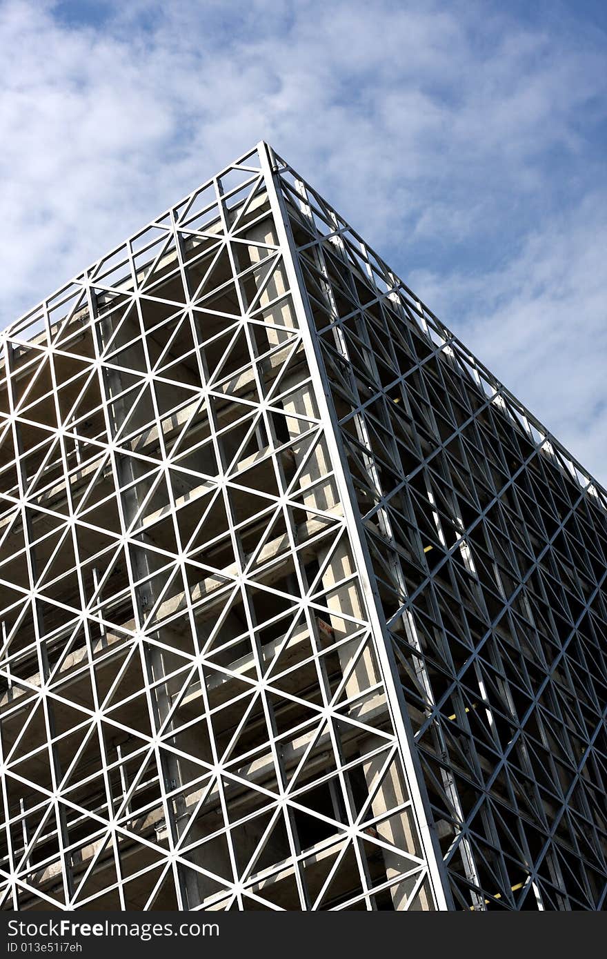 Abstract metallic building and blue sky vertical