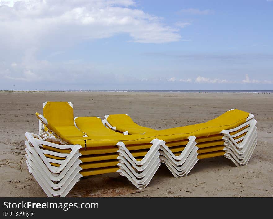 Stocked yellow beach chairs at the beach