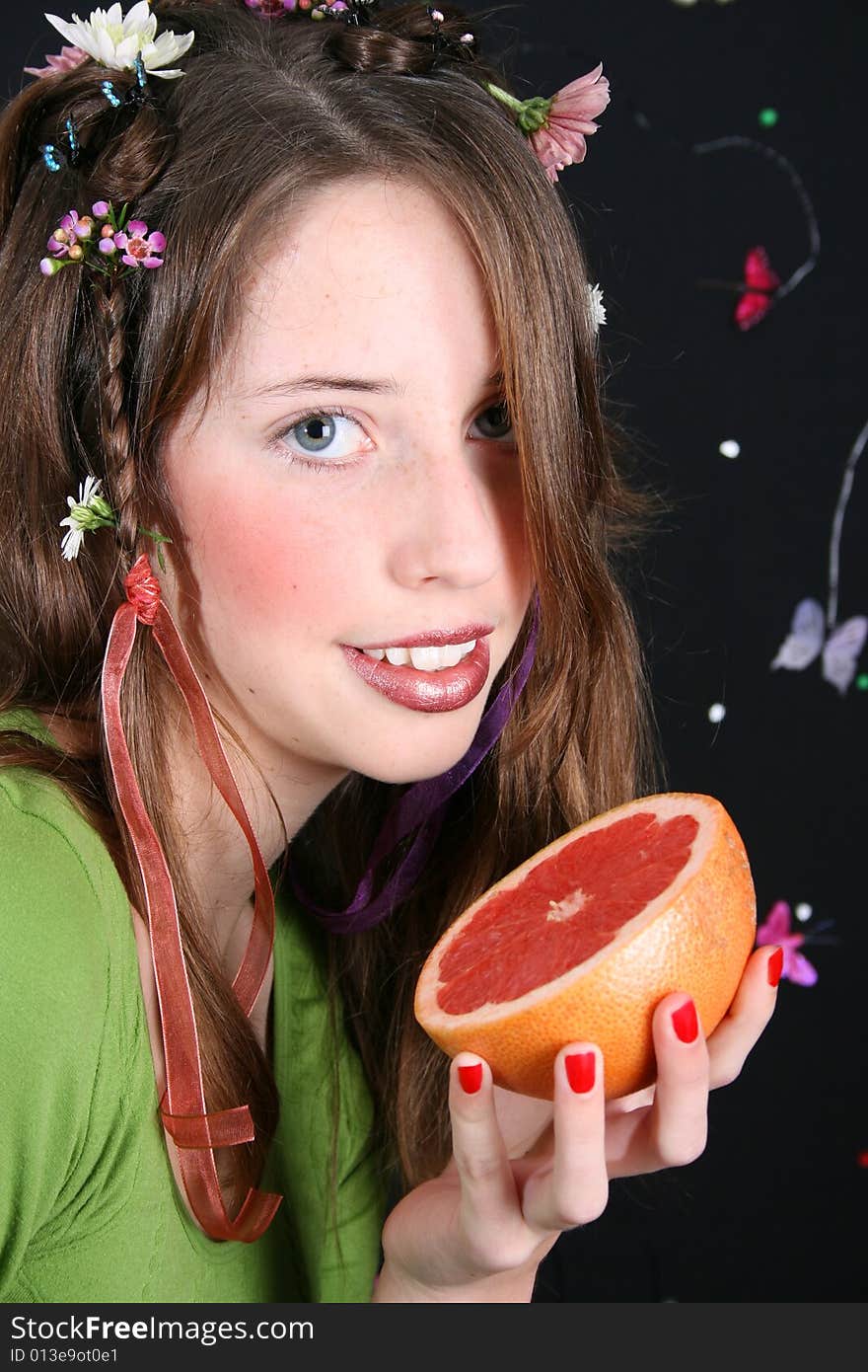 Teenage model with flowers and butterflies in her hair. Teenage model with flowers and butterflies in her hair