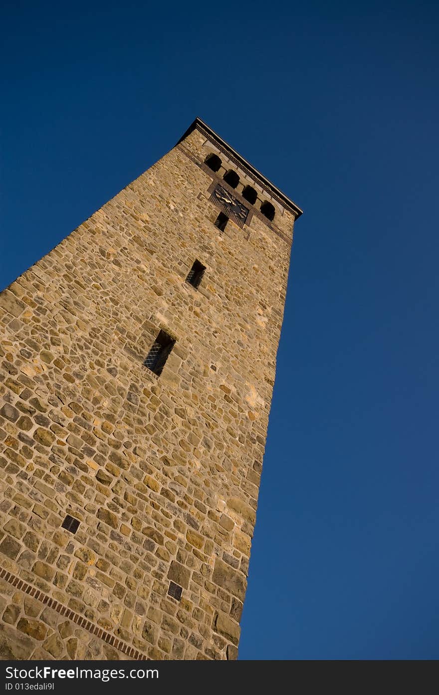 Church tower made of sandstone with a blue sky