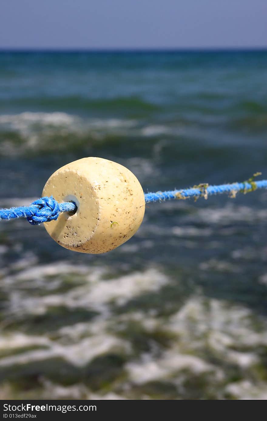 Bouys float and knot on the blue rope.