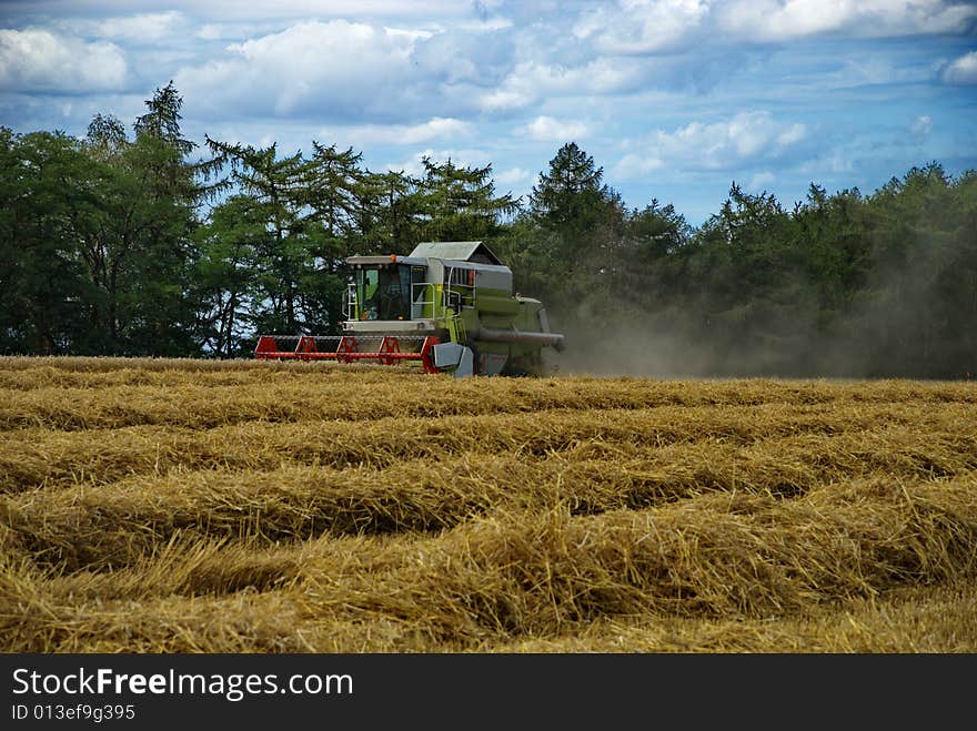 A harvester doing its job in the late summer. Czech Republic, August 2008. A harvester doing its job in the late summer. Czech Republic, August 2008.