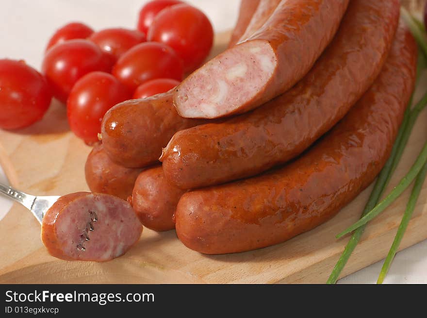 Sausage with tomatoes and chives