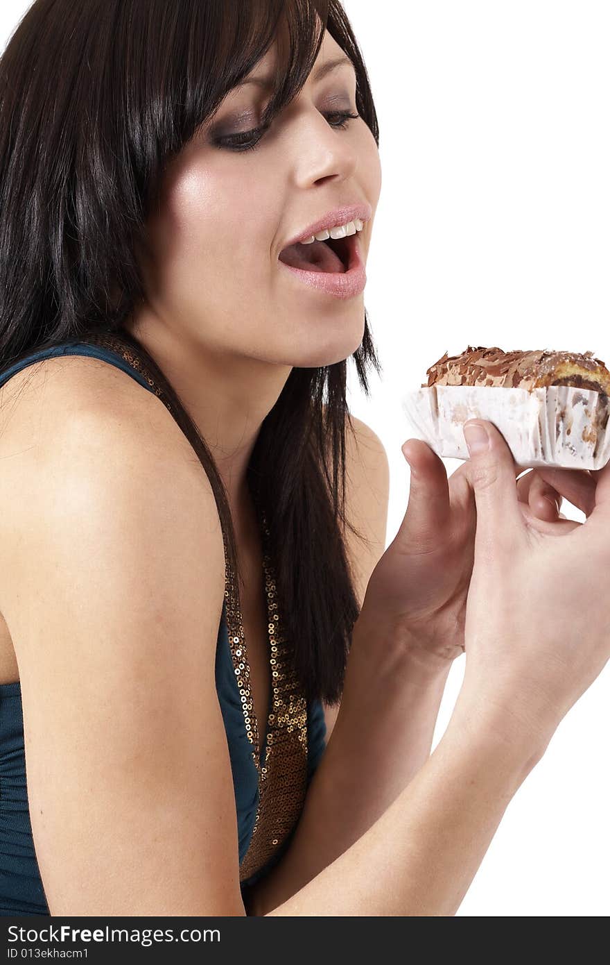 Portrait of a beautiful young brunette woman tempted to eat a chocolate cake. Portrait of a beautiful young brunette woman tempted to eat a chocolate cake