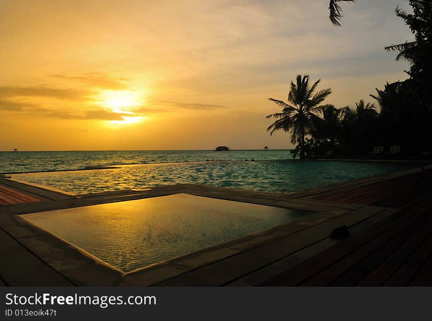 View of sunset on a tropical beach in Maldives