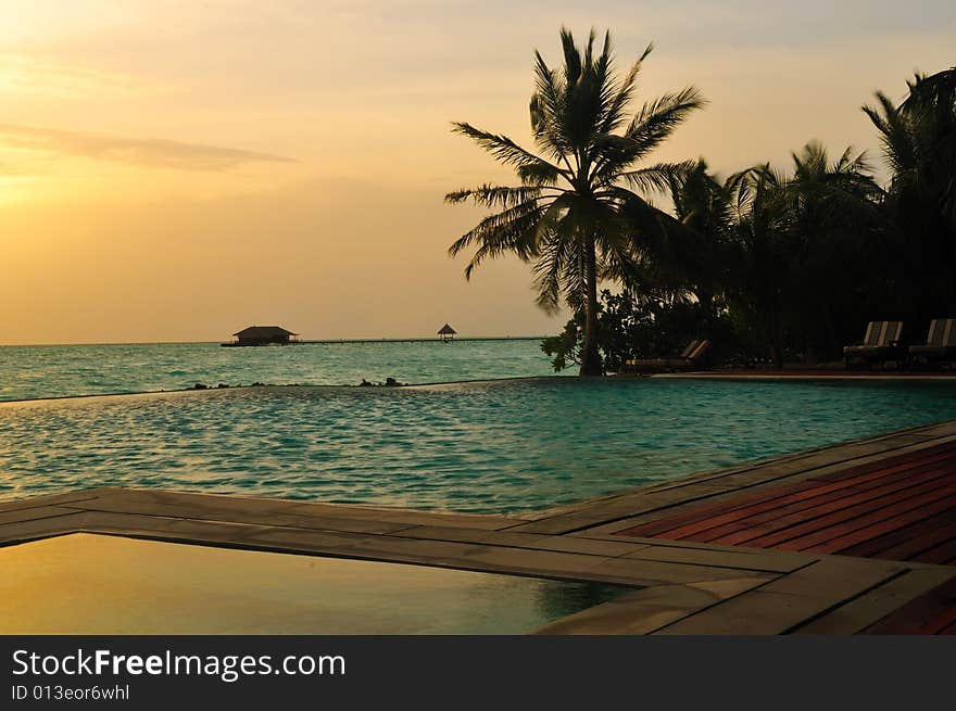 View of sunset on a tropical beach in Maldives