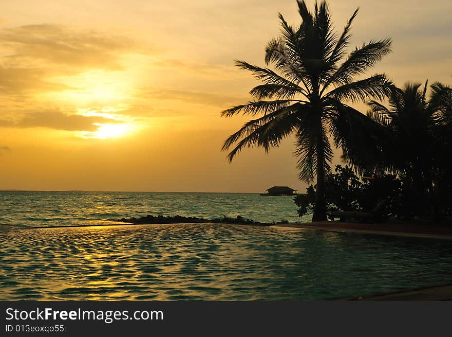 View of sunset on a tropical beach in Maldives