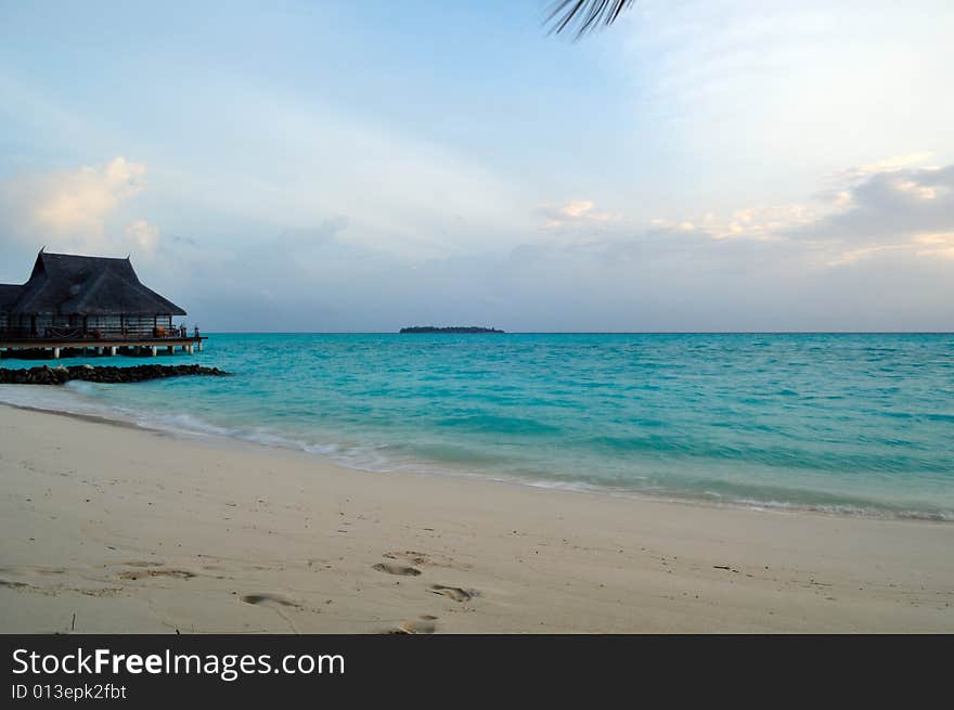 View of sunset on a tropical beach in Maldives