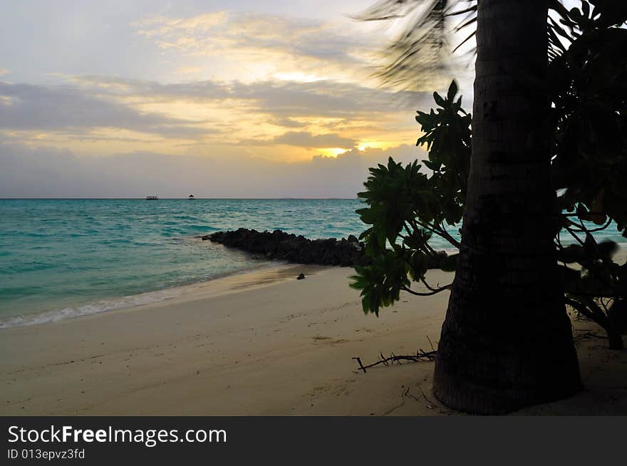 View of sunset on a tropical beach in Maldives