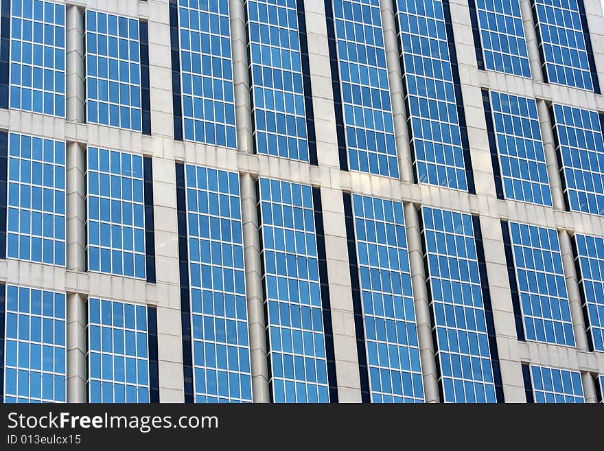 Close-up of a glass building with blue tint