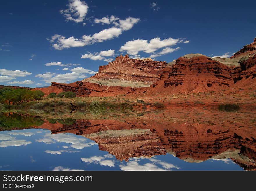 View of the red rock formations in Capitol Reef National Park with blue sky�s and clouds. View of the red rock formations in Capitol Reef National Park with blue sky�s and clouds