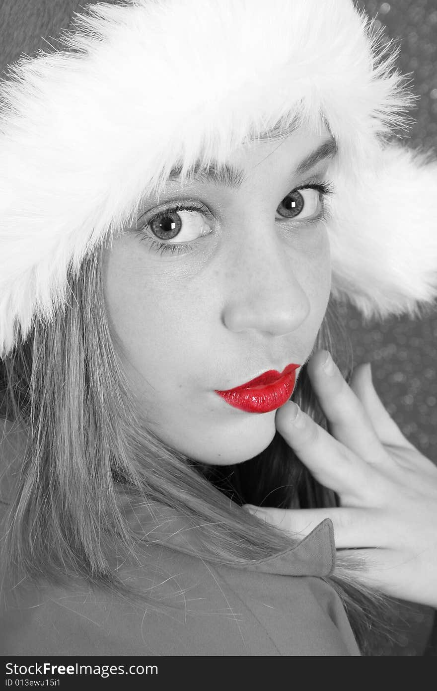 Teenager with red lips wearing a christmas hat. Teenager with red lips wearing a christmas hat