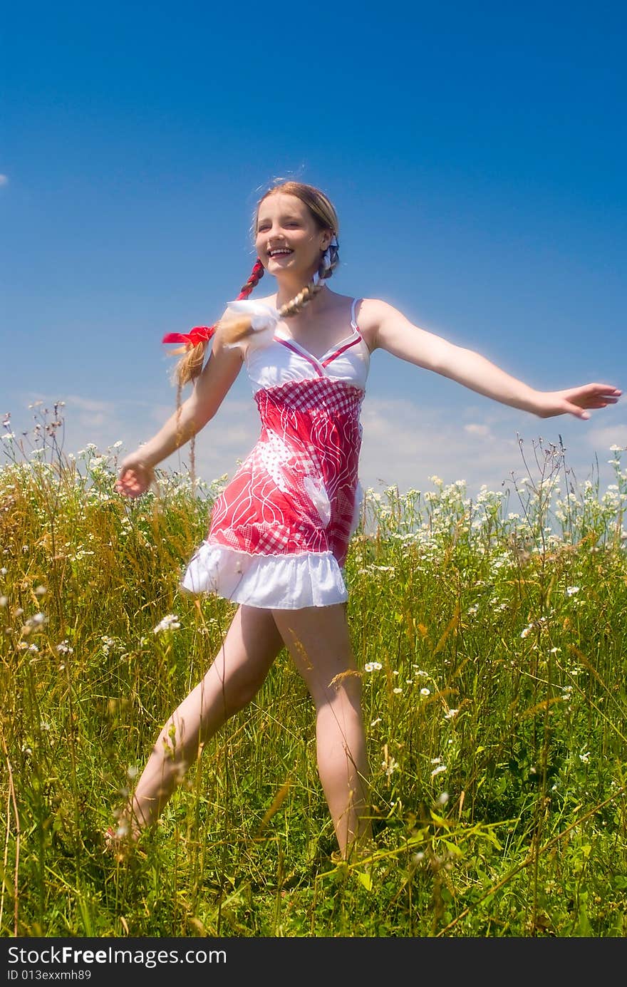 Girl enjoying summertime outdoor. Soft focus lens. Girl enjoying summertime outdoor. Soft focus lens