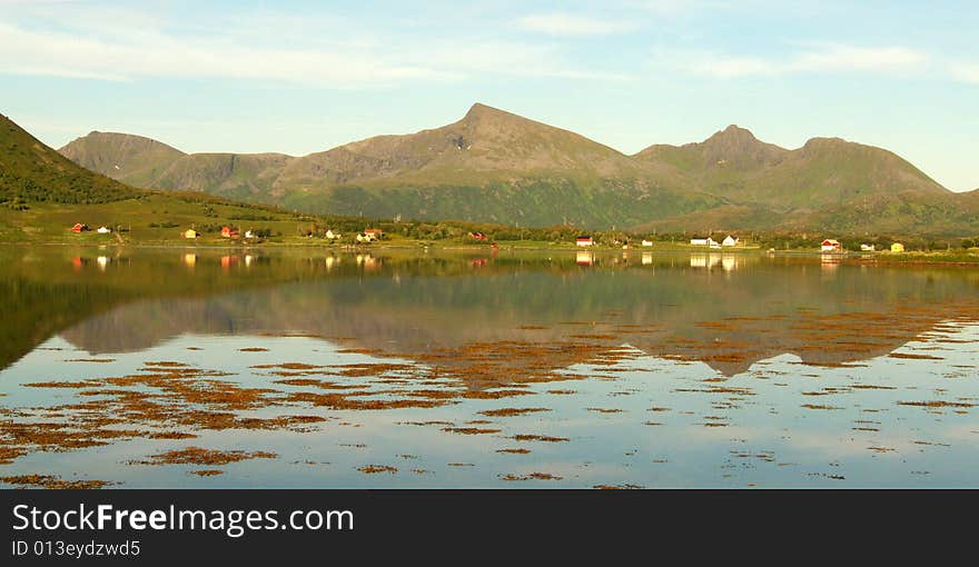 Lofoten s village  mirroring at midnight