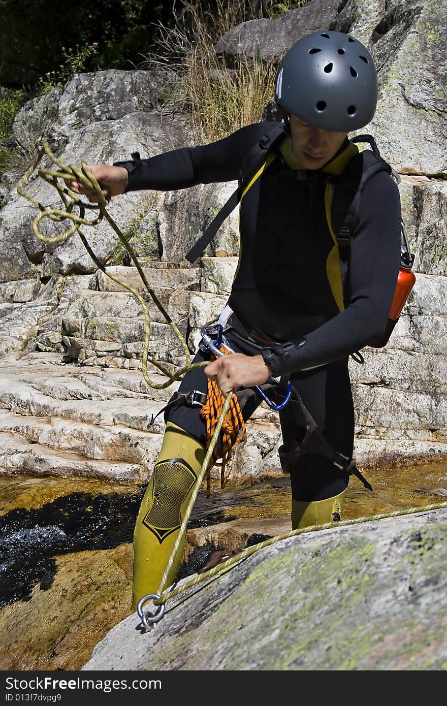 Men prepering for descending waterfall in rappel