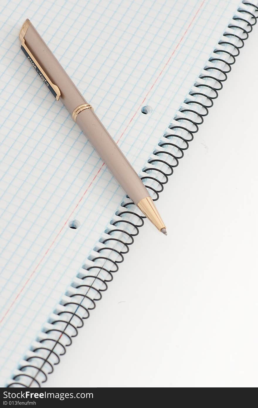 Notebook with pen on white background. Notebook with pen on white background