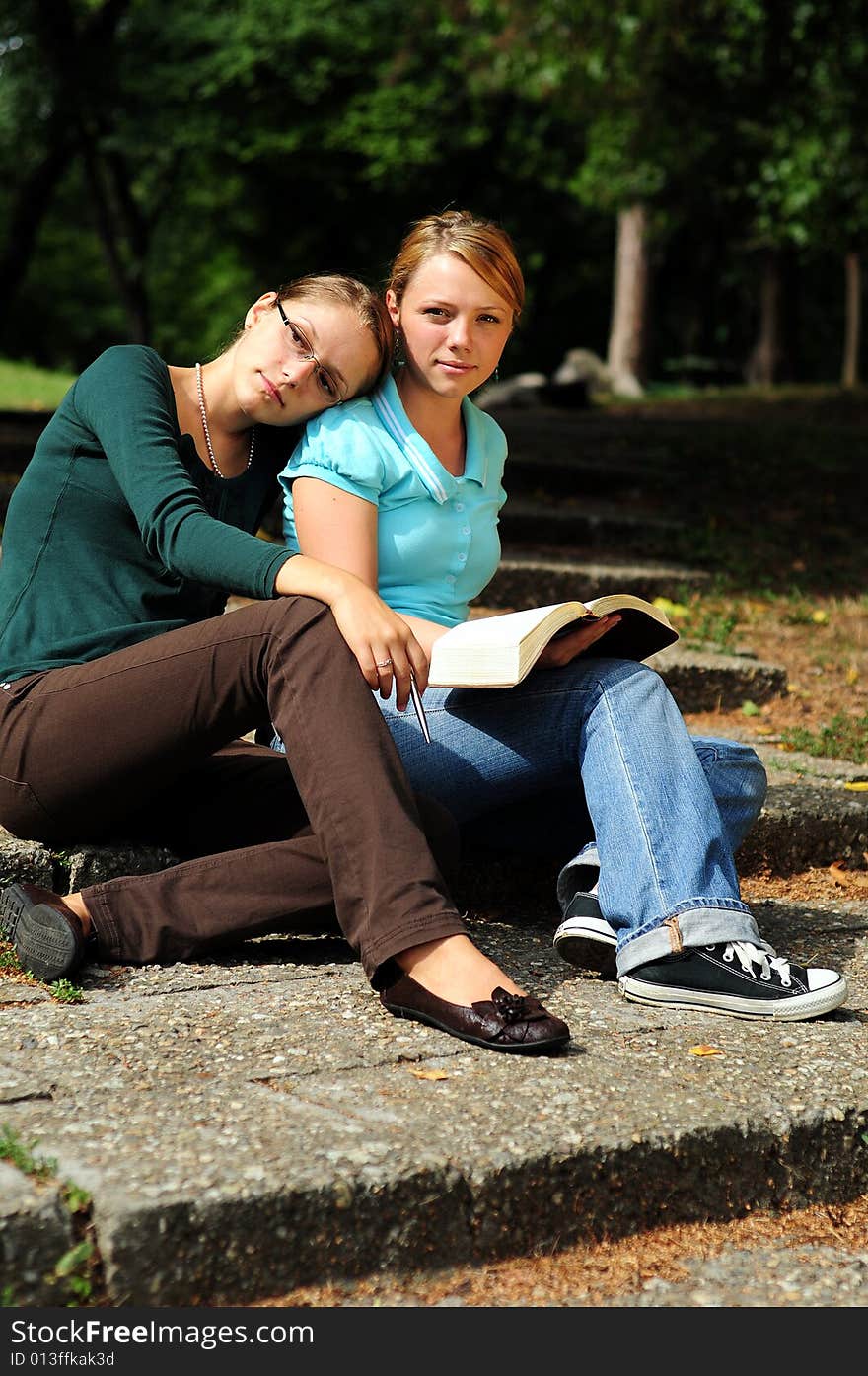 Sisters Reading in a public park. Sisters Reading in a public park