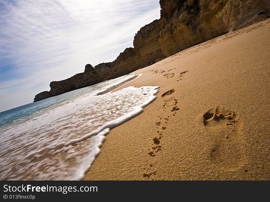 Footprints on a beach in the Algarve, Portugal. Footprints on a beach in the Algarve, Portugal