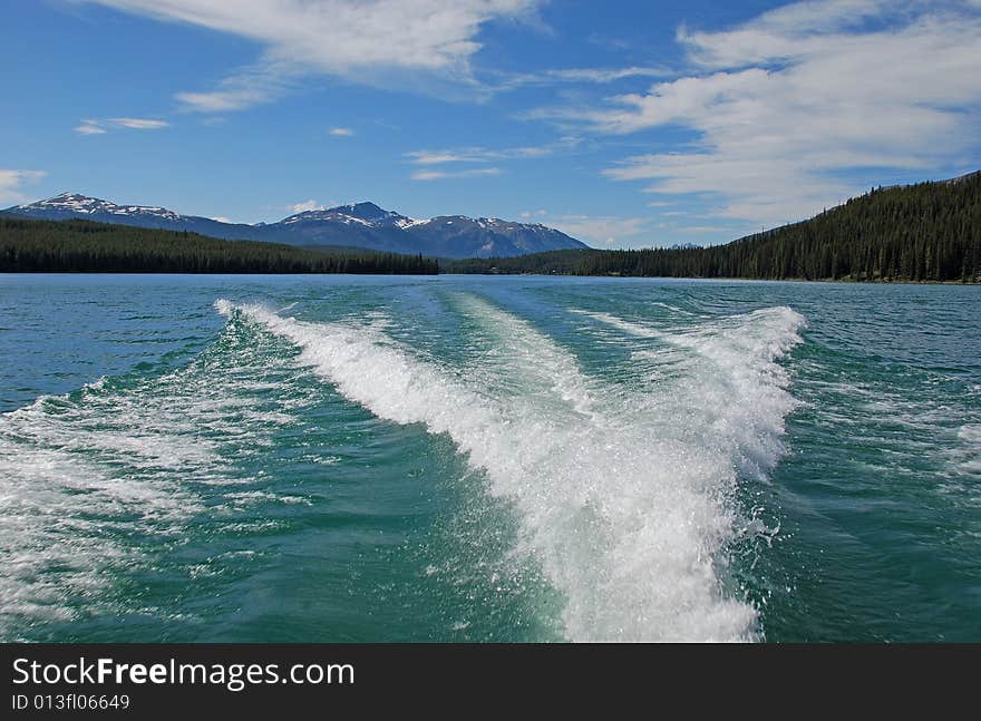 Waves caused by the Motor Boat driving on the Magline Lake Jasper National Park Alberta Canada