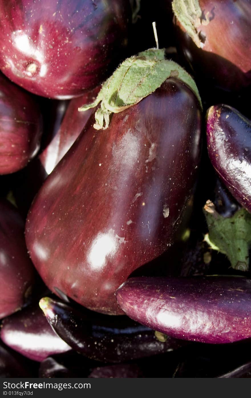 Group of purple eggplants. Vertically framed photo. Group of purple eggplants. Vertically framed photo.