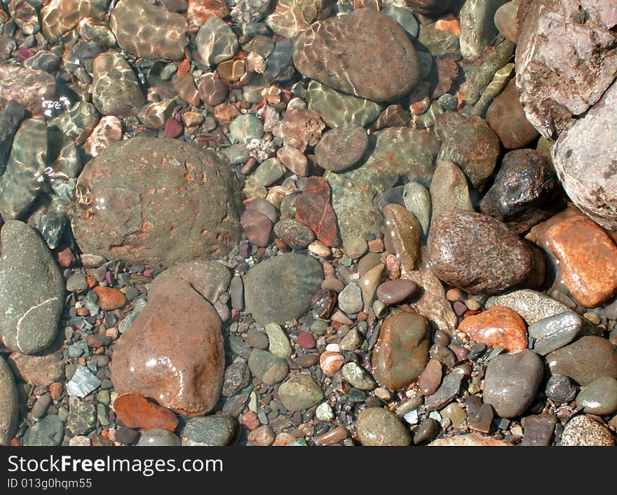 Background with stones under current water. Background with stones under current water.