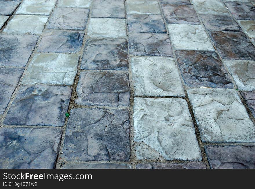 Close-up of new old-style pavement of bricks of grey color