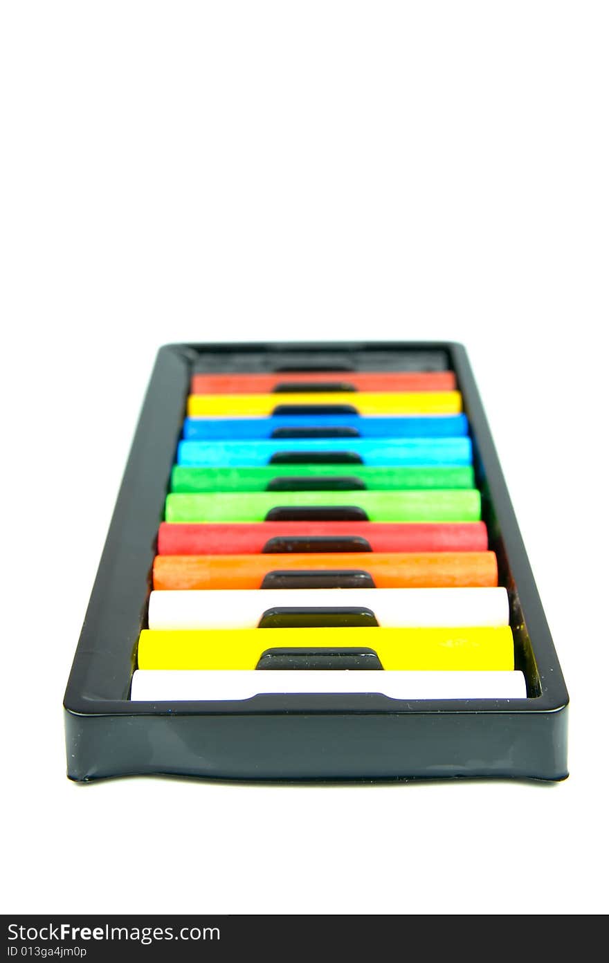 Oil pastels/crayons isolated against a white background