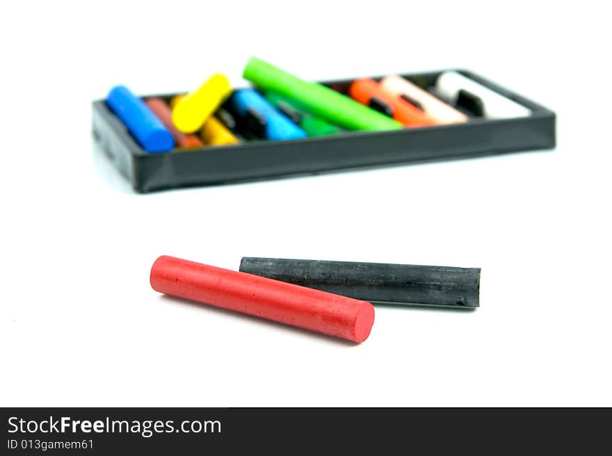 Oil pastels/crayons isolated against a white background