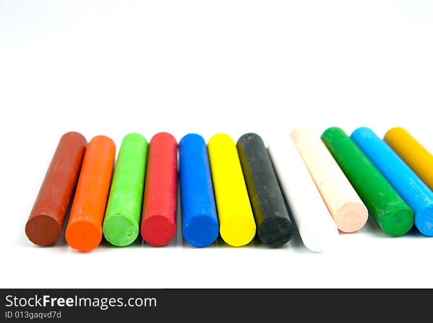 Oil pastels/crayons isolated against a white background